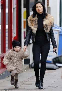 Adorable: Dolly looked super cute in a shaggy woolen coat and a black beanie